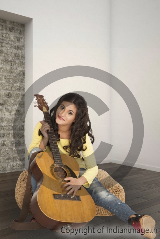 Girl posing with guitar